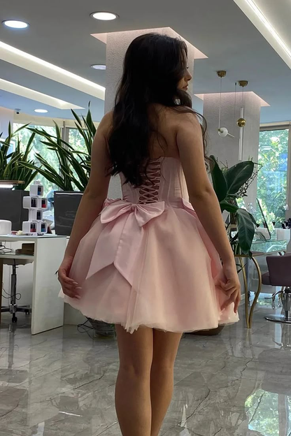 Rosa trägerloses A-Linien-Kurzkorsett-Heimkehrkleid mit Schleife J7209
