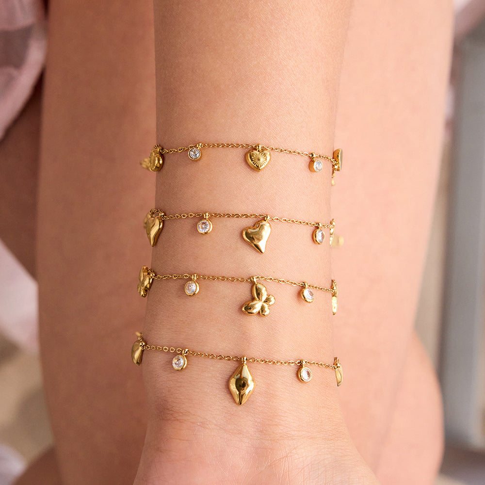 Bracelet en acier inoxydable avec zircons et motif cœur et papillon G40